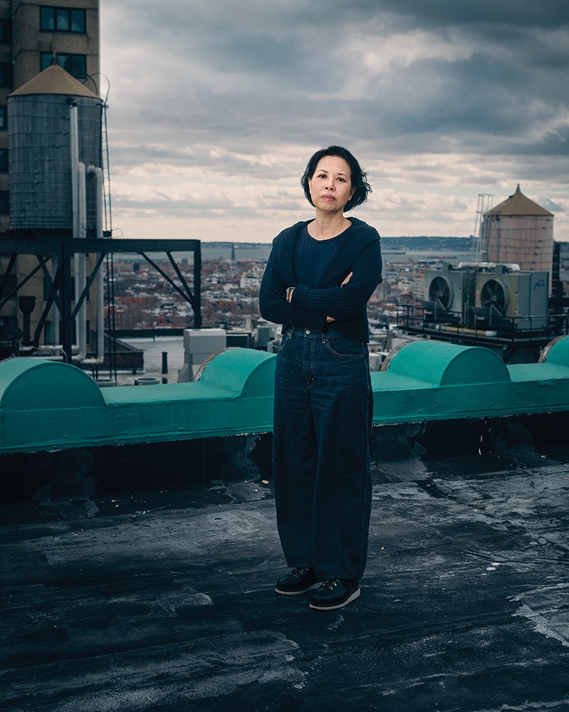 Photographer An-My Lê standing on the rooftop of her Brooklyn studio building.