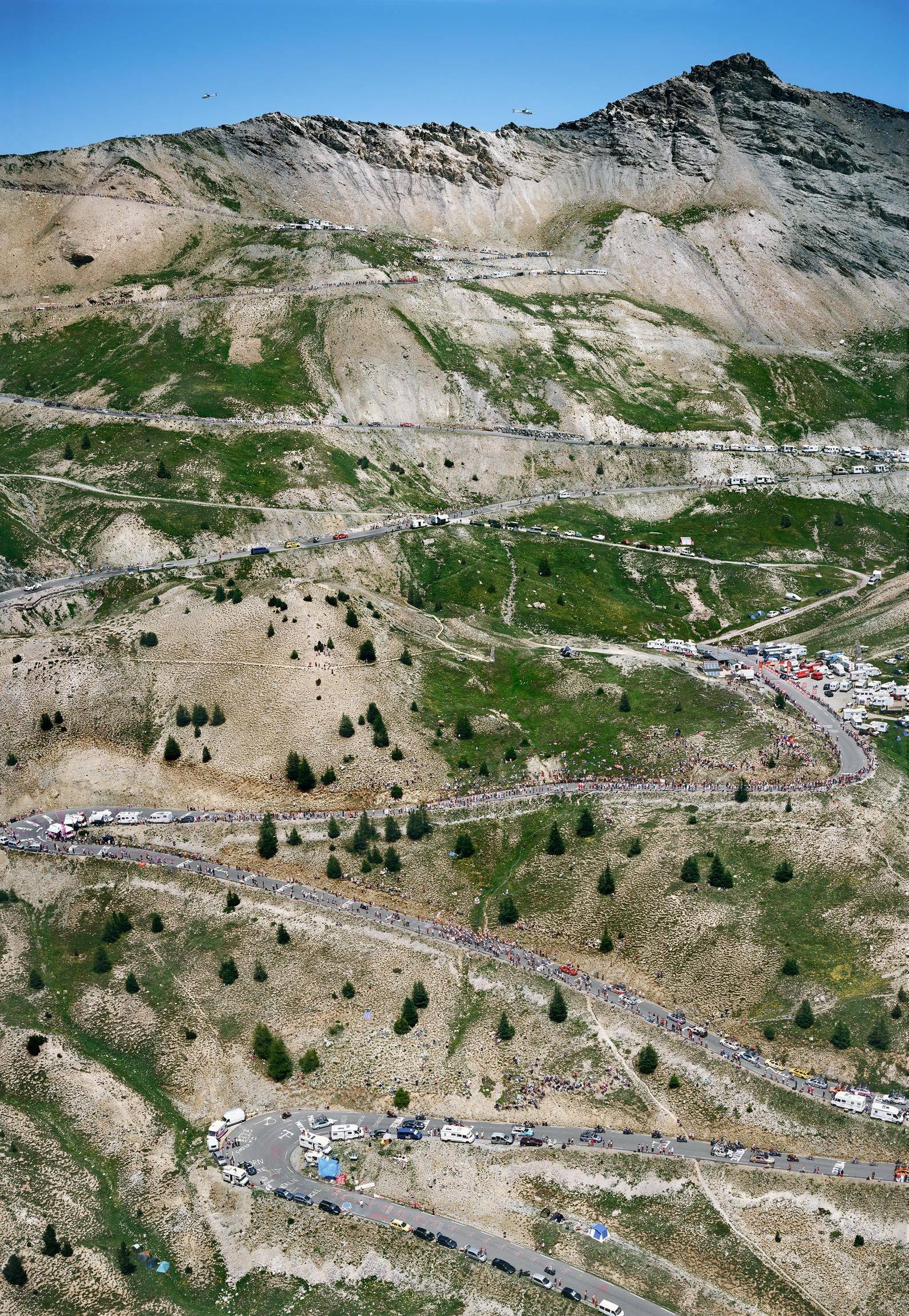 An aerial view of bicyclists climbing a mountain during the Tour de France.